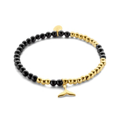 Kralenarmband met zwarte agaat kralen en walvis bedel