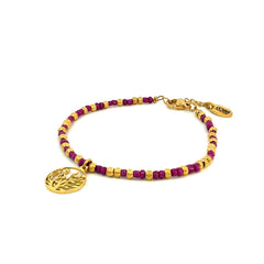 Kralenarmband met paarse kralen en bedel in de vorm van blaadjes