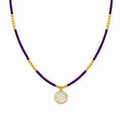 Ketting met paarse kralen en bedel